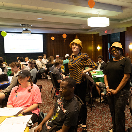 Jana Xanthakos and Kathy Smiling watch over students while they participate in a personality test.