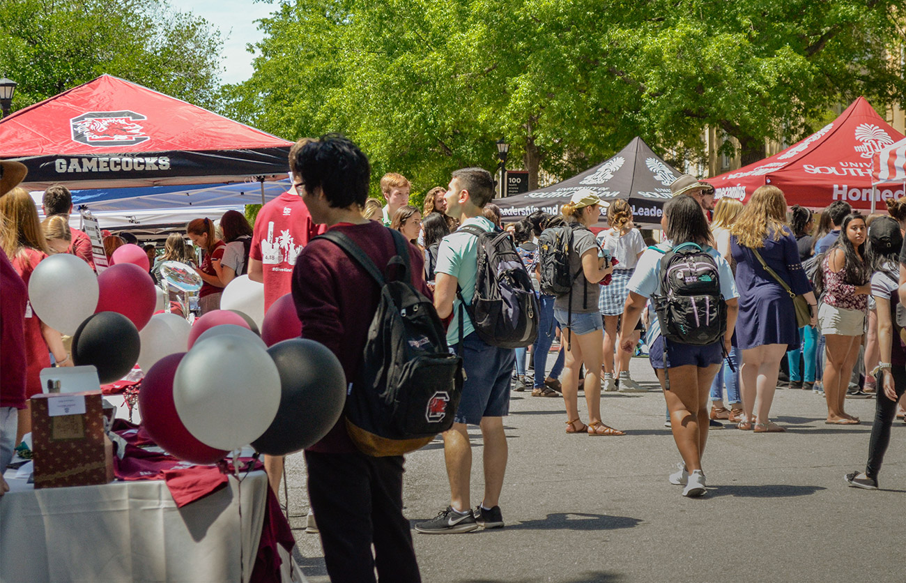 Students gathered at the Student Org Fair on Greene Street checking out the tents for each organization.