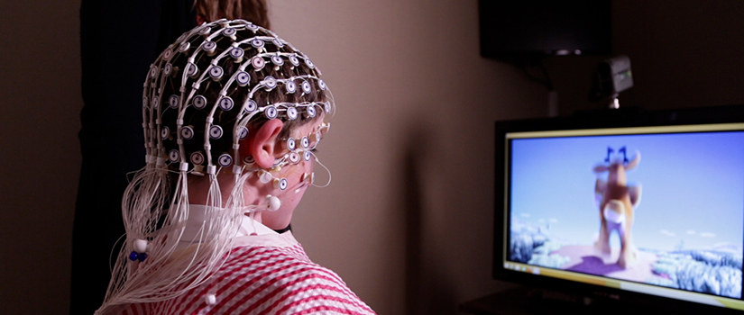 Photo of a child being analyzed. The video will feature an interviews about the center.