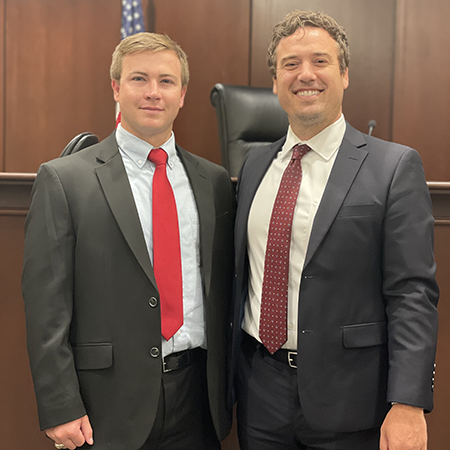 Rivers Benton ('25) and his supervisor, Ryan White ('15 law)