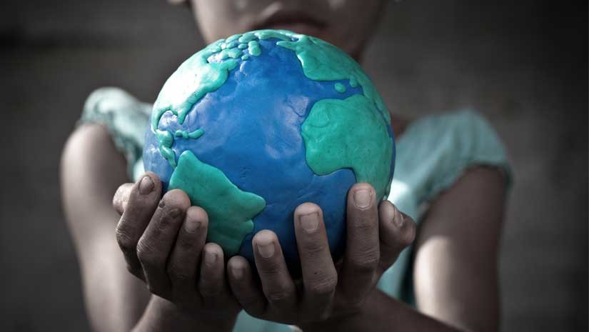 Girl holding a globe