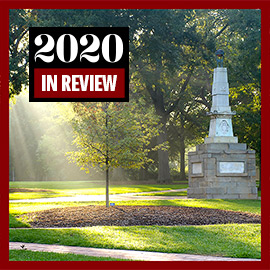 Maxcy Monument on the Historic Horseshoe with sunlight streaming through the trees. 