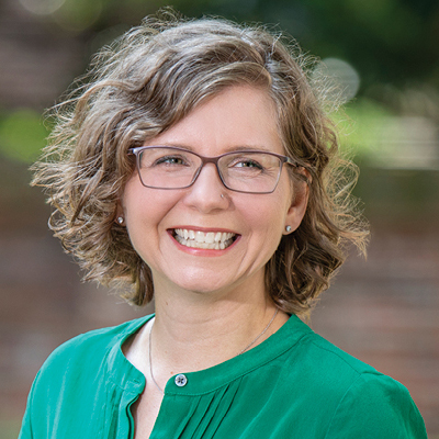 Andersen smiles as she gets her photo taken on campus