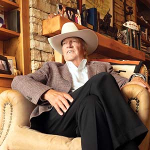 Joe Rice in his office with an off-white cowboy hat atop his head