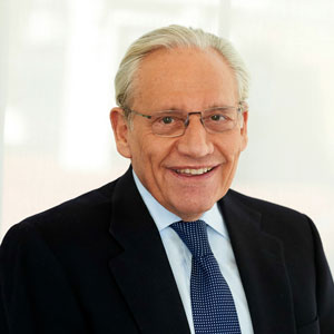 man in a suit and tie against a white background